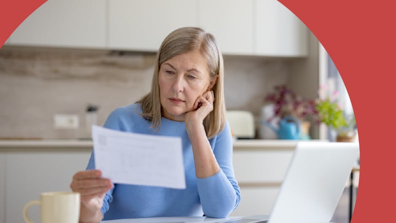 A retired woman looking over the rules and regulations of her 55+ community.
