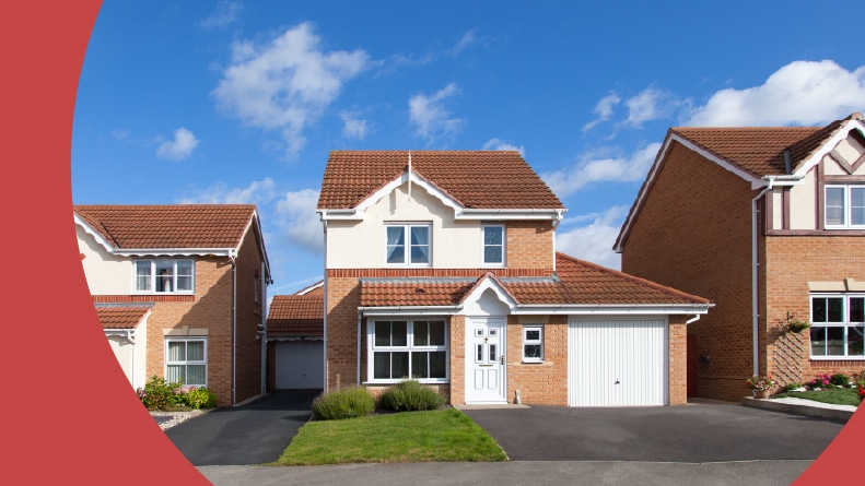 Front view of a row of detached houses on a sunny day.