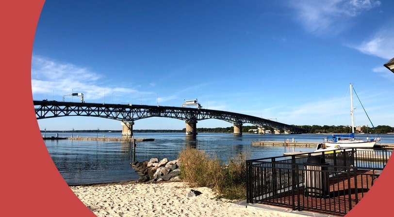 A bridge and docking area in Williamsburg, Virginia, on a sunny day in the fall.