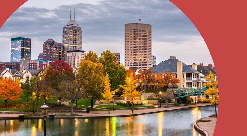 The Indianapolis skyline along the White River at dusk.