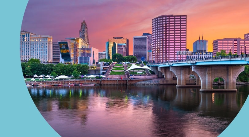 The downtown skyline of Hartford, Connecticut at dusk.
