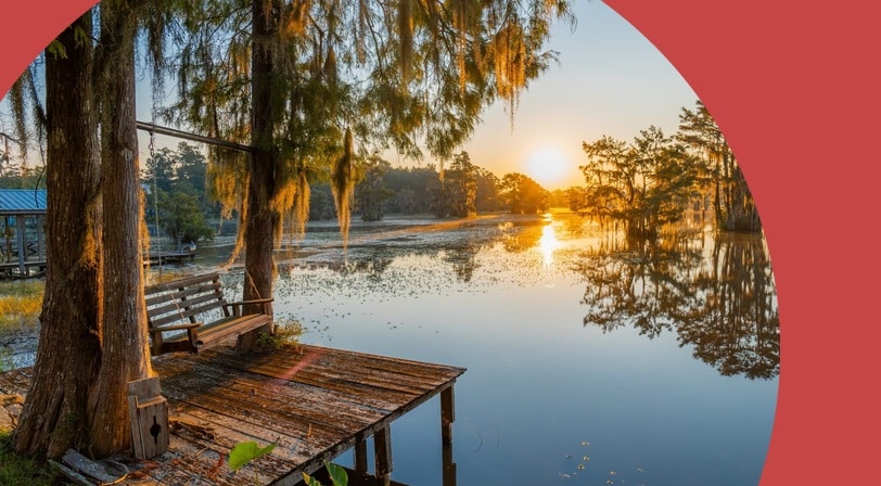 A small dock along Alabama's Gantt Lake at sunrise.