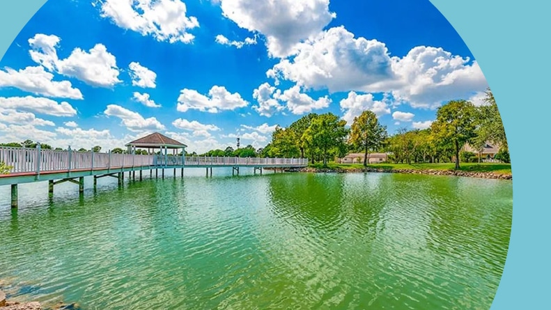 A boardwalk over a pond on the grounds of CountryPlace in Pearland, Texas.