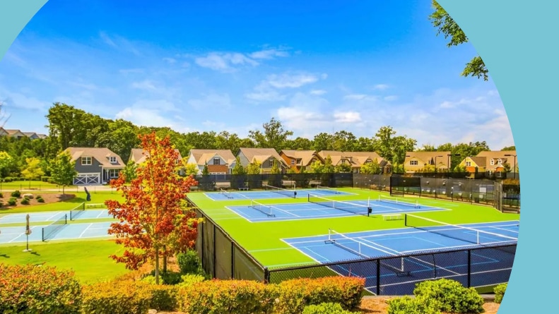 Homes surrounding the tennis and pickleball courts at Cresswind at Lake Lanier, a 55+ community in Gainesville, Georgia.