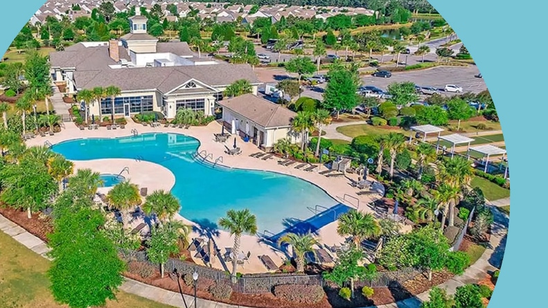 Aerial view of the outdoor pool and clubhouse at Del Webb at Cane Bay in Summerville, South Carolina.
