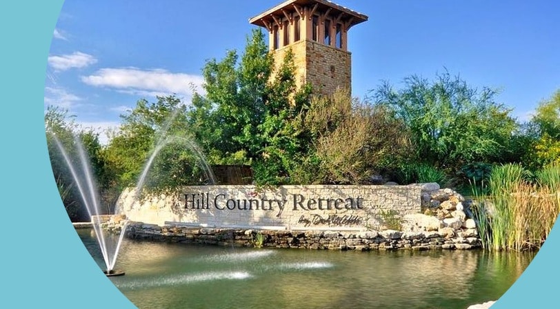 Community entrance monument and fountain at Hill Country Retreat, a 55+ community in San Antonio, Texas.