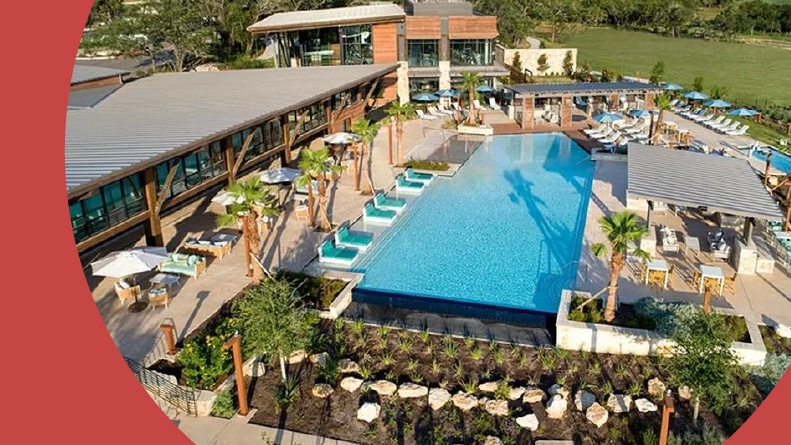 Aerial view of the outdoor pool and amenities at Kissing Tree in San Marcos, Texas.