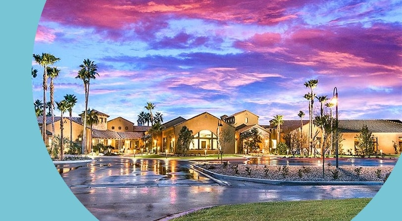 Clubhouse at sunset at Robson Ranch Arizona, a 55+ community in Eloy, Arizona.