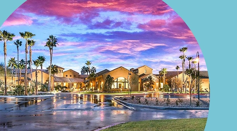 Clubhouse at sunset at Robson Ranch Arizona, a 55+ community in Eloy, Arizona.