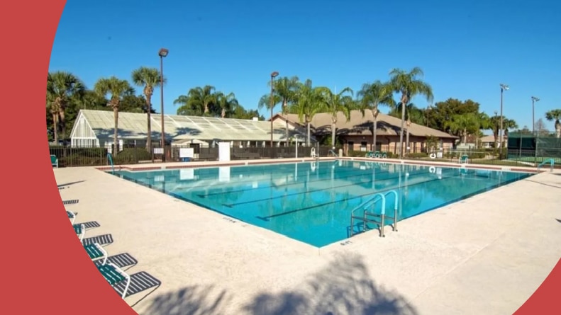 Lounge chairs surrounding the outdoor pool at Royal Highlands, a 55+ community in Leesburg, Florida.