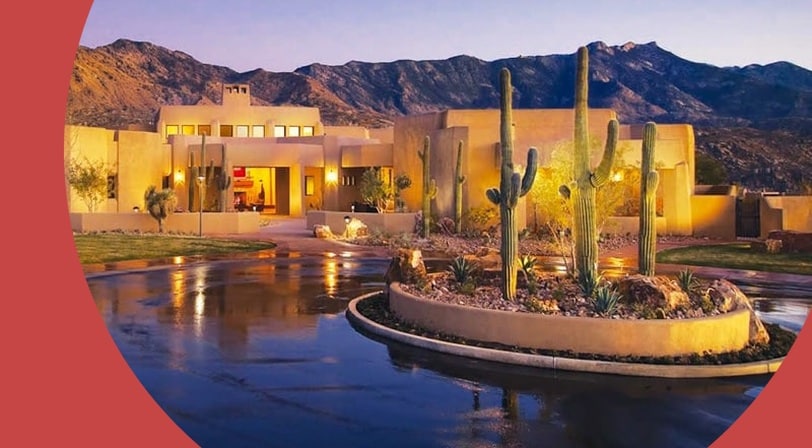 Clubhouse at dusk with mountain views at SaddleBrooke, a 55+ community in Tucson, Arizona.