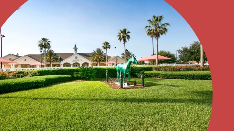 A horse statue and palm trees at the entrance to SummerGlen, a 55+ community in Ocala, Florida.