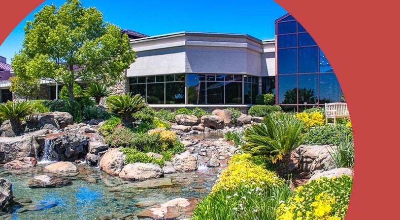 Clubhouse and landscaped water feature at Sun City Lincoln Hills, a 55+ community in Lincoln, California.