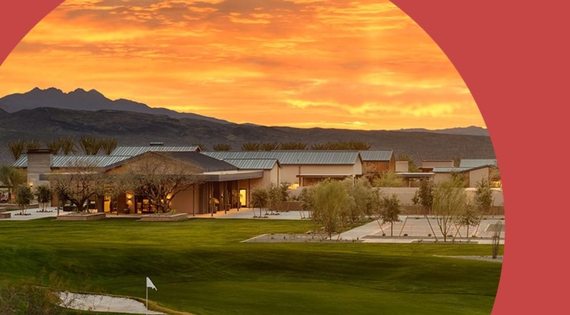 Clubhouse and golf course at sunset at Trilogy at Verde River, a 55+ community in Rio Verde, Arizona.