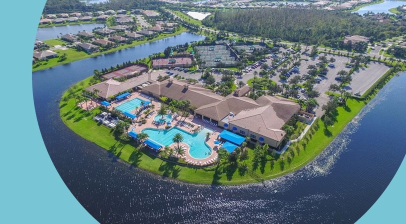 Aerial view of the pool and clubhouse at Valencia Lakes, a 55+ community in Wimauma, Florida.