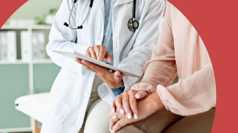 Closeup on the hands of a doctor and patient.