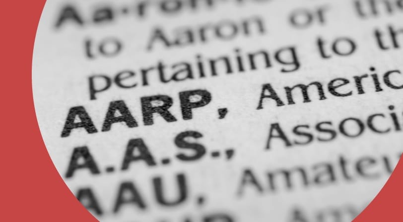 Blurry page of abbreviations with AARP being the most prominent.