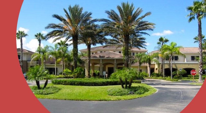 Palm trees beside the entrance of Kings Point in Sun City Center, Florida.