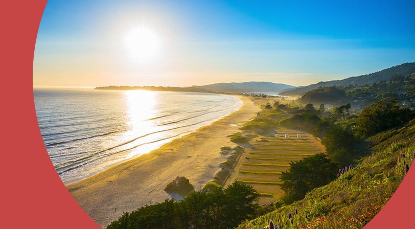 Aerial view of a beach in California on a sunny day.