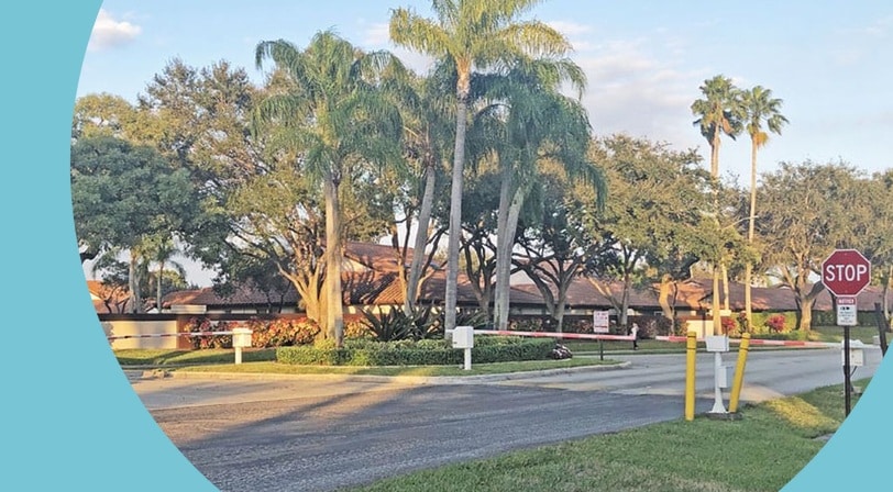 The gated entrance at Huntington Pointe, a 55+ community in Delray Beach, Florida.