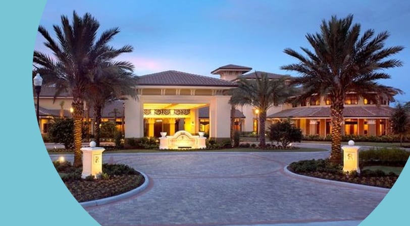 Palm trees beside the entrance to Sun City Center, a 55+ community in Sun City Center, Florida.