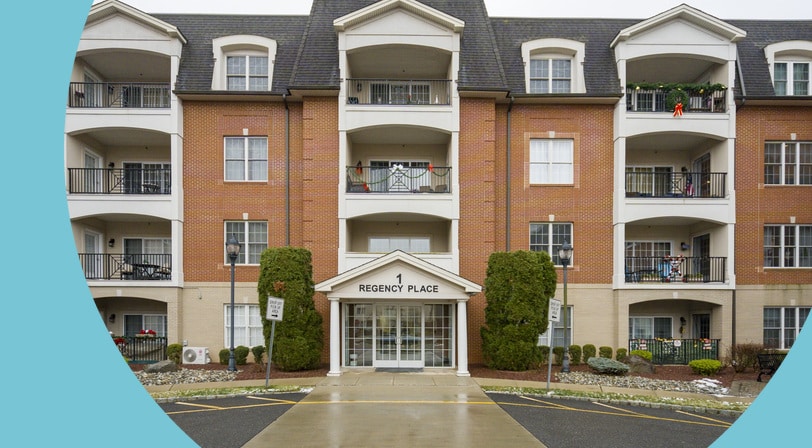 The front entrance of the condo building at Parkview Crossings at Woodbridge, a 55+ community in Woodbridge, New Jersey.