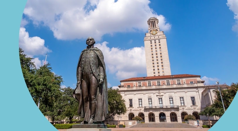 A bronze statue of George Washington standing in front of the University of Texas Tower on a sunny day with scattered clouds.