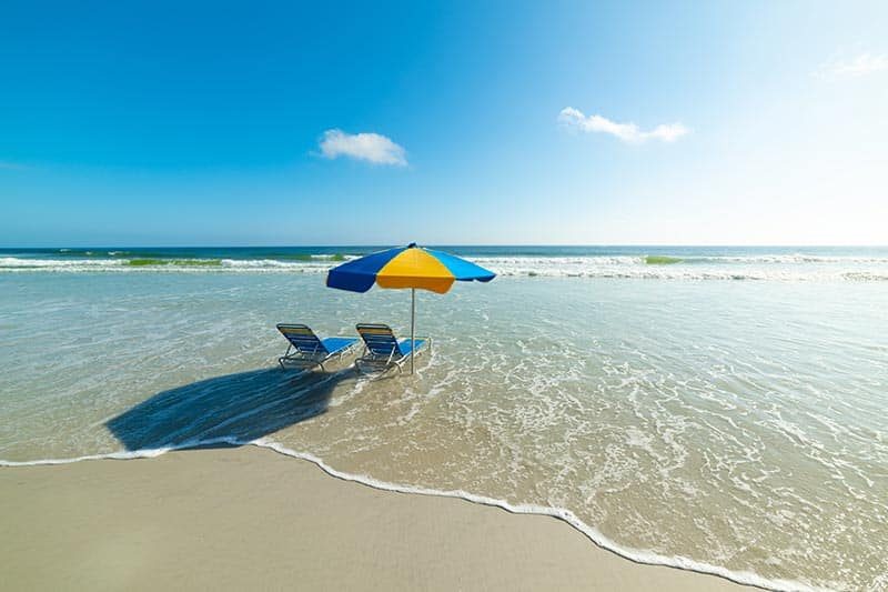 Beach chairs and parasol in Daytona Beach, Florida.