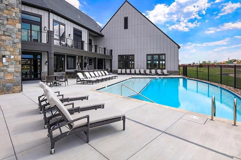 Lounge chairs beside the outdoor pool at Birchwood at Brambleton in Ashburn, Virginia.