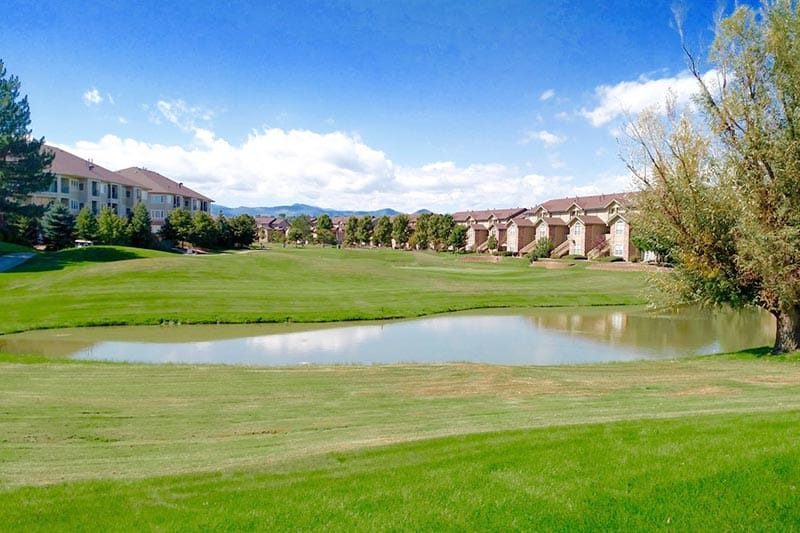 A pond on the golf course beside homes at Centennial at RiverWalk in Littleton, Colorado.
