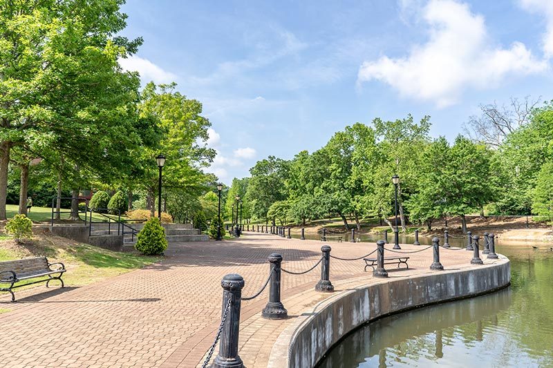 A walkway beside the water in Cleveland Park in Spartanburg, South Carolina.