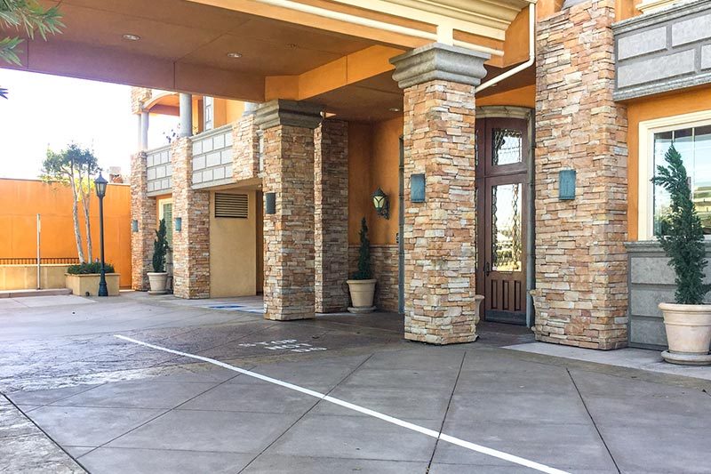 Exterior view of an entrance to a community building at Courtyard Villa Estates in Torrance, California.