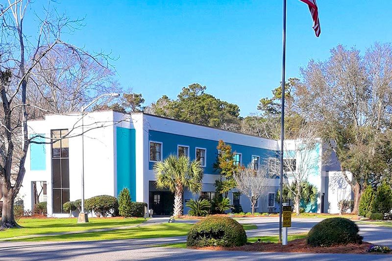 Exterior view of a community building on the grounds of Covenant Towers in Myrtle Beach, South Carolina.