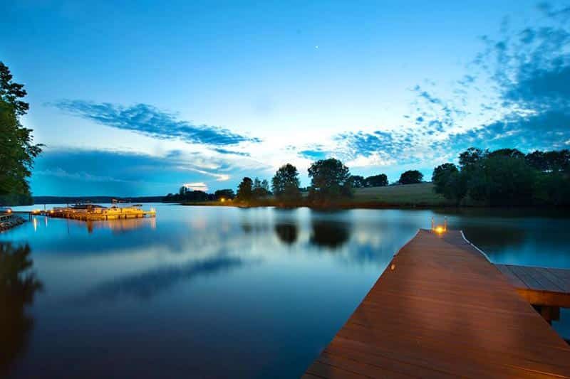 Twilight view of the dock along the lake on the grounds of Del Webb at Lake Oconee,a 55+ community in Greensboro, Georgia.