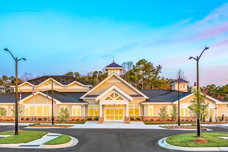 Exterior view of the clubhouse and entrance to Del Webb at Traditions in Wake Forest, North Carolina.