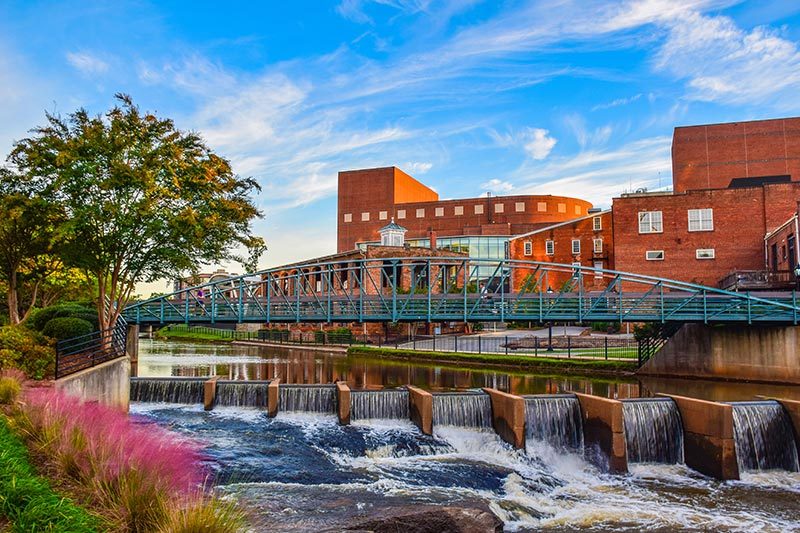 View of Reedy River Bridge and Wyche Pavilion Peace Center in Downtown Greenville, South Carolina, South Carolina.