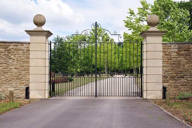 An iron gate at the entrance of a 55+ community