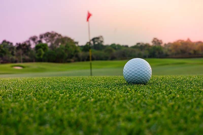 golfball-on-a-green-at-sunset-in-a-55-community