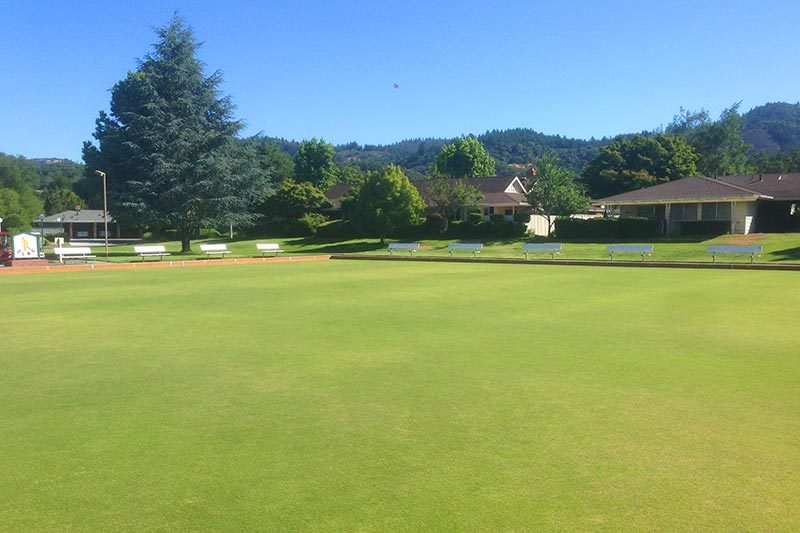 Benches beside a sports field on the grounds of Oakmont Village in Santa Rosa, California.