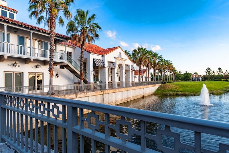 A walkway beside a pond on the grounds of Solivita, a 55+ community in Kissimmee, Florida.