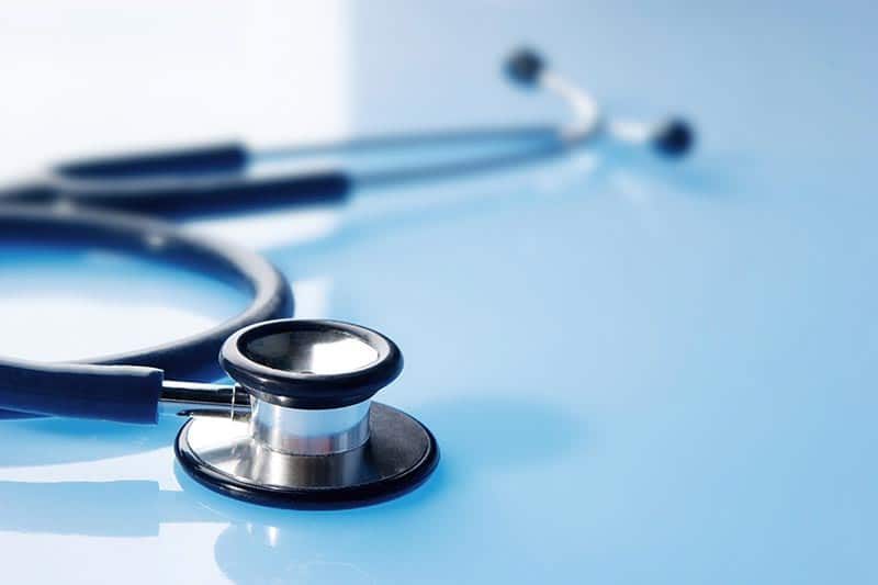 A stethoscope on a table in a medical facility near a 55+ community.
