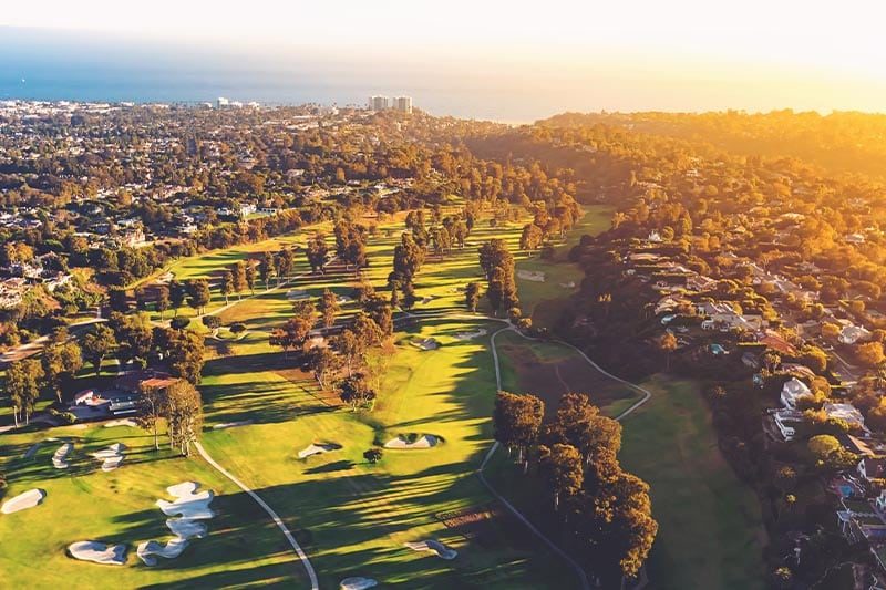 Aerial view of Brentwood California golf course at sunset.