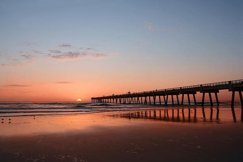 Sunrise over a pier in Jacksonville, Florida.