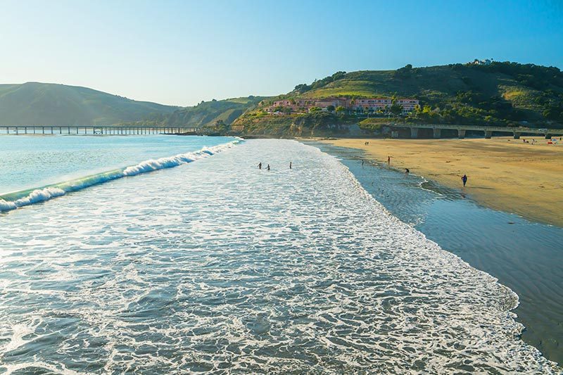 People enjoying Avila Beach located in San Luis Obispo County in California.