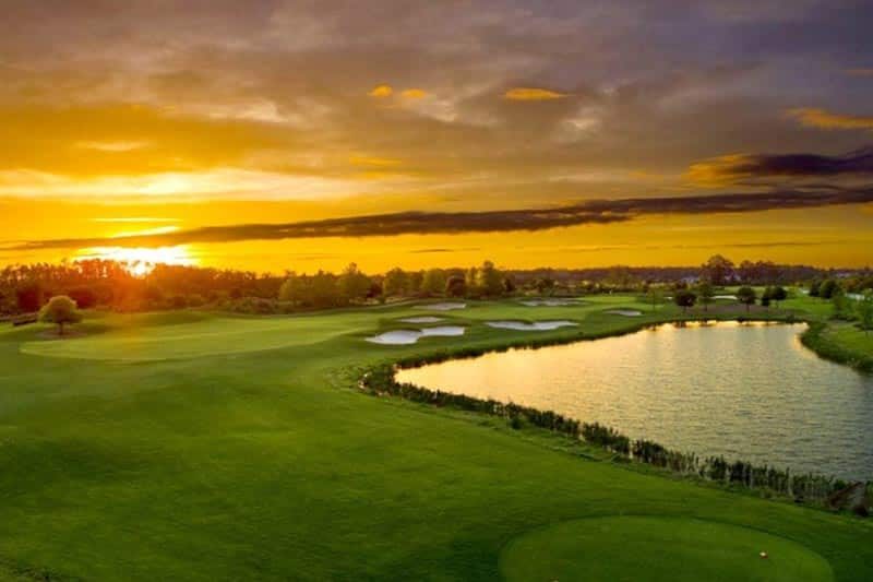 Sunset over the golf course at The Lakes at Harmony in Harmony, Florida.