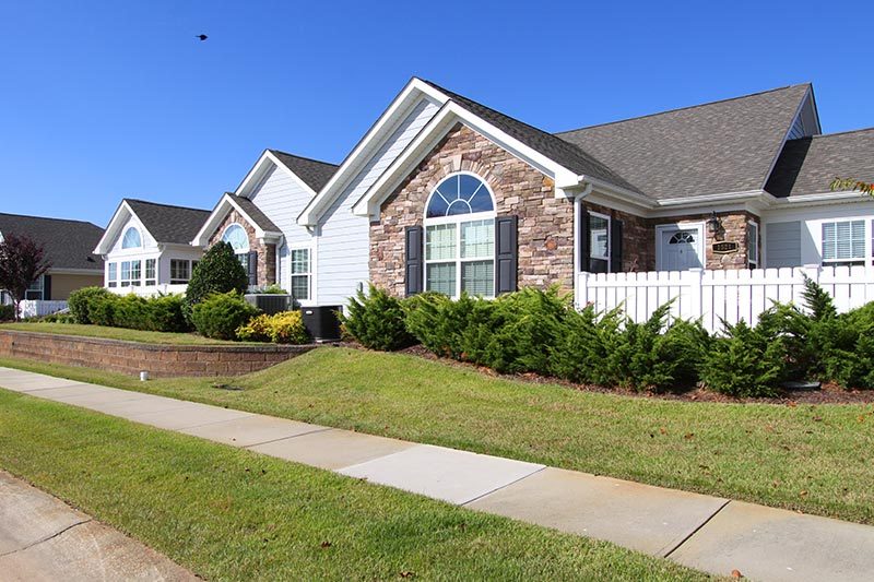 the-orchard-villas-apex-north-carolina Exterior view of residential properties at The Orchard Villas in Apex, North Carolina.