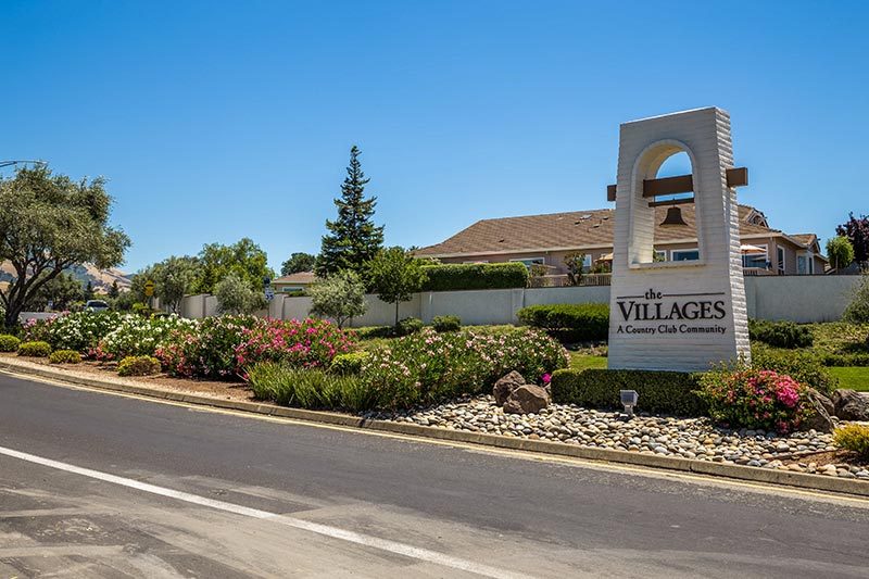 The community sign at the entrance of The Villages Golf & Country Club in San Jose, California.