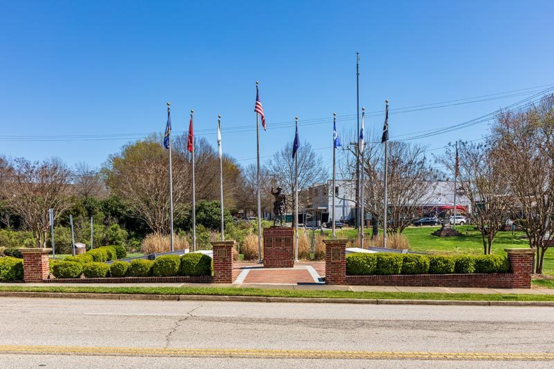 A monument and flag poles at the Veterans Park in Fort Mill, South Carolina.