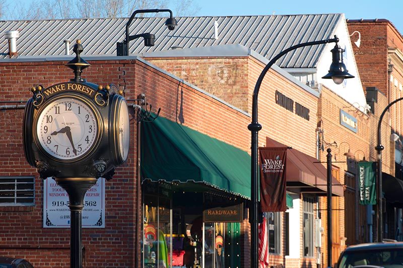 View down the street of Downtown Wake Forest, North Carolina on a sunny morning.